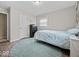 Neutral bedroom featuring laminate flooring, bright light, and cozy decor, providing a comfortable and relaxing retreat at 5415 Honey Comb Ln, Indianapolis, IN 46221