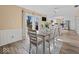 Bright dining room with table and chairs, and sliding glass doors to the backyard at 5415 Honey Comb Ln, Indianapolis, IN 46221