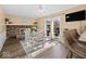 Cozy dining room with a brick fireplace, table and chairs, and sliding glass doors to the backyard at 5415 Honey Comb Ln, Indianapolis, IN 46221