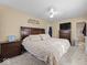 Spacious main bedroom featuring a large bed, stylish furnishings, and ensuite bathroom access, offering comfort and convenience at 5415 Honey Comb Ln, Indianapolis, IN 46221