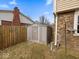 Backyard shed with brick exterior, perfect for storage and organization in the outdoor space at 5415 Honey Comb Ln, Indianapolis, IN 46221