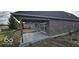 Backyard view with a covered concrete patio perfect for outdoor relaxation and entertaining at 6641 Stone Pointe Way, Indianapolis, IN 46237