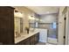 Bathroom featuring double sinks, granite countertops, and a glass-enclosed shower at 6641 Stone Pointe Way, Indianapolis, IN 46237