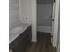 Bathroom with a white vanity and tub at 6641 Stone Pointe Way, Indianapolis, IN 46237