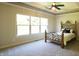 Bright bedroom features neutral carpet, a large window, and an elegant iron bed frame at 6641 Stone Pointe Way, Indianapolis, IN 46237