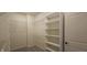 Walk-in closet features wire shelving and a built-in shelving unit for optimal storage at 6641 Stone Pointe Way, Indianapolis, IN 46237