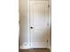 A white paneled door with black hardware is presented in a neutral setting at 6641 Stone Pointe Way, Indianapolis, IN 46237