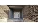 Inviting entryway featuring a white door with sidelights and stylish brick and siding accents at 6641 Stone Pointe Way, Indianapolis, IN 46237