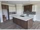 Bright kitchen featuring a large island, custom cabinets, and modern backsplash at 6641 Stone Pointe Way, Indianapolis, IN 46237