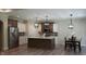 Kitchen featuring stainless steel appliances, an island, and modern pendant lights at 6641 Stone Pointe Way, Indianapolis, IN 46237