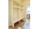 Mudroom features a built-in storage bench and wood-look floors at 6641 Stone Pointe Way, Indianapolis, IN 46237