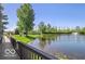 Beautiful community pond with a fountain and landscaped surroundings creating a serene atmosphere at 6641 Stone Pointe Way, Indianapolis, IN 46237