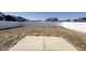 Spacious backyard with white fence and patio on a sunny day at 673 Ballycastle Ct, Pendleton, IN 46064