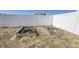 Backyard features raised garden beds enclosed by a white fence, adding functionality and charm at 673 Ballycastle Ct, Pendleton, IN 46064