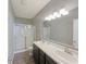 Bathroom featuring double sinks, a shower, and wood-look flooring at 673 Ballycastle Ct, Pendleton, IN 46064