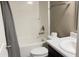 Compact bathroom featuring a shower/tub, toilet, and vanity with black cabinetry at 673 Ballycastle Ct, Pendleton, IN 46064