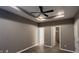 Bedroom featuring trey ceiling, fan, hardwood floors, and closet and doorway, providing a serene retreat at 673 Ballycastle Ct, Pendleton, IN 46064