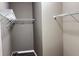 Walk-in closet with wire shelving and wood-look flooring at 673 Ballycastle Ct, Pendleton, IN 46064