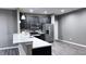 Modern kitchen with stainless steel appliances, a breakfast bar, and pendant lighting fixtures at 673 Ballycastle Ct, Pendleton, IN 46064