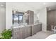 Spacious bathroom featuring granite countertops, double sinks, and a large mirror with stunning outside views at 720 S Rangeline Rd # 601, Carmel, IN 46032