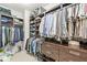 Functional closet features ample hanging space, shelving, and drawer storage for optimal organization at 720 S Rangeline Rd # 601, Carmel, IN 46032