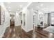 Bright hallway featuring arched doorways and hardwood floors at 720 S Rangeline Rd # 601, Carmel, IN 46032