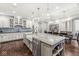 Bright eat-in kitchen features a large island, granite countertops, and an open design at 720 S Rangeline Rd # 601, Carmel, IN 46032