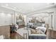 Spacious living room featuring a wet bar, elegant furniture, and modern design elements for luxury living at 720 S Rangeline Rd # 601, Carmel, IN 46032