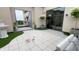 Charming outdoor patio with stylish tile flooring, greenery, and inviting access to a well-maintained garden and water feature at 720 S Rangeline Rd # 601, Carmel, IN 46032