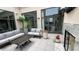Inviting outdoor patio featuring stylish seating, a modern fireplace, and sleek sliding glass doors for seamless indoor-outdoor living at 720 S Rangeline Rd # 601, Carmel, IN 46032