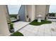 Elegant outdoor patio featuring manicured landscaping, a decorative fountain, and stylish tile flooring for sophisticated outdoor living at 720 S Rangeline Rd # 601, Carmel, IN 46032