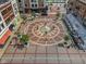 Aerial view of a lively town square featuring a decorative fountain, outdoor dining, and pedestrian-friendly walkways at 720 S Rangeline Rd # 601, Carmel, IN 46032