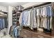 Spacious walk-in closet with custom shelving and hanging rods providing ample storage at 720 S Rangeline Rd # 601, Carmel, IN 46032