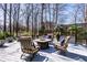 Backyard patio setting with comfortable seating and a fire pit, perfect for outdoor entertaining at 8845 Otter Cove Cir, Indianapolis, IN 46236