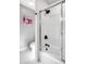 Bright bathroom featuring a shower with black fixtures and white tiled surround at 8845 Otter Cove Cir, Indianapolis, IN 46236