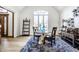 Bright breakfast nook with a glass-top table, modern decor, and a large arched window, perfect for morning coffee at 8845 Otter Cove Cir, Indianapolis, IN 46236