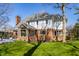 Beautiful two-story home showcasing a well-manicured lawn, brick accents, and a cozy deck area at 8845 Otter Cove Cir, Indianapolis, IN 46236