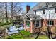 Scenic view of the home's exterior highlighting the deck, sunroom, and landscaped surroundings at 8845 Otter Cove Cir, Indianapolis, IN 46236