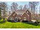 Charming brick home with a well-manicured lawn, mature trees, and a welcoming entrance at 8845 Otter Cove Cir, Indianapolis, IN 46236