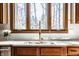 This is a light-filled kitchen with an undermount sink and view of trees out the window at 8845 Otter Cove Cir, Indianapolis, IN 46236