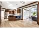 Open kitchen with stainless steel appliances, a center island, and wood cabinets, offering a modern cooking space at 8845 Otter Cove Cir, Indianapolis, IN 46236