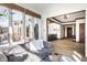Bright living room has many windows and hardwood floors, leading into another room with a hall entryway at 8845 Otter Cove Cir, Indianapolis, IN 46236