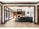 Comfortable living room with built-in shelves, fireplace, large windows with light, and comfortable seating at 8845 Otter Cove Cir, Indianapolis, IN 46236