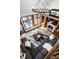 Aerial living room boasts a striking chandelier, fireplace, large windows, and comfortable seating at 8845 Otter Cove Cir, Indianapolis, IN 46236