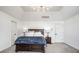 Comfortable main bedroom with a dark wood bed frame, soft lighting, and cozy bedding, perfect for restful nights at 8845 Otter Cove Cir, Indianapolis, IN 46236