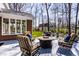 Charming outdoor patio with comfortable seating and a fire pit, perfect for entertaining at 8845 Otter Cove Cir, Indianapolis, IN 46236
