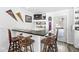 Well-equipped bar area with seating, complete with shelving, enhances the entertainment space for gatherings at 925 Forest Dr, Anderson, IN 46011