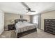 Comfortable bedroom featuring carpet, a ceiling fan, and dark wood furniture at 925 Forest Dr, Anderson, IN 46011