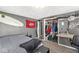 A gray bedroom with a desk and closet at 925 Forest Dr, Anderson, IN 46011