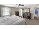 Spacious bedroom with carpet, ceiling fan, and ample storage at 925 Forest Dr, Anderson, IN 46011